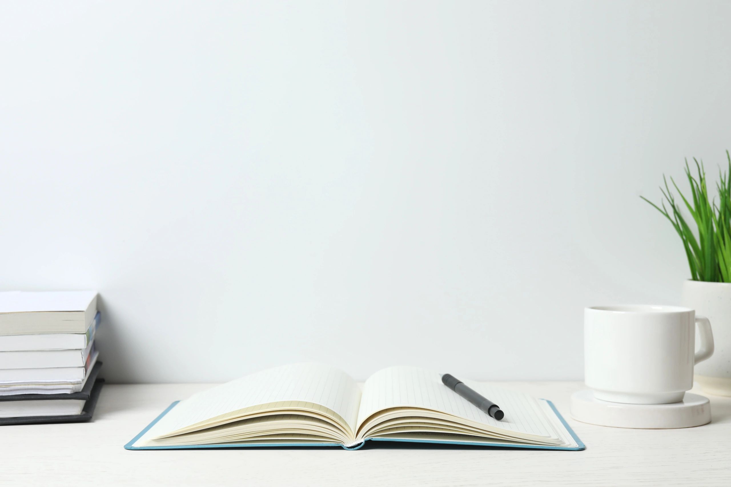 Elegant open notebook and desk accessories in a bright workspace